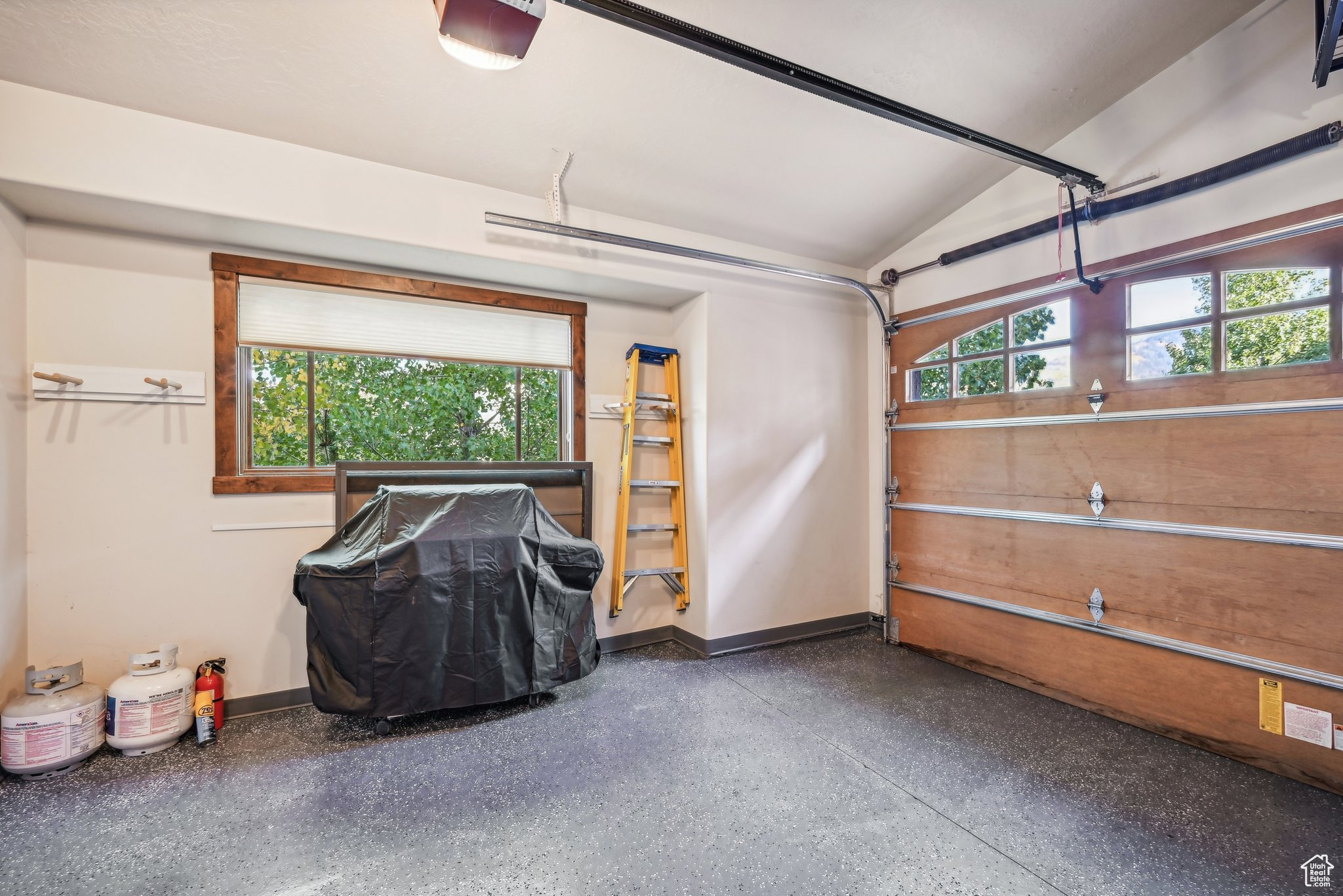 Garage featuring a garage door opener