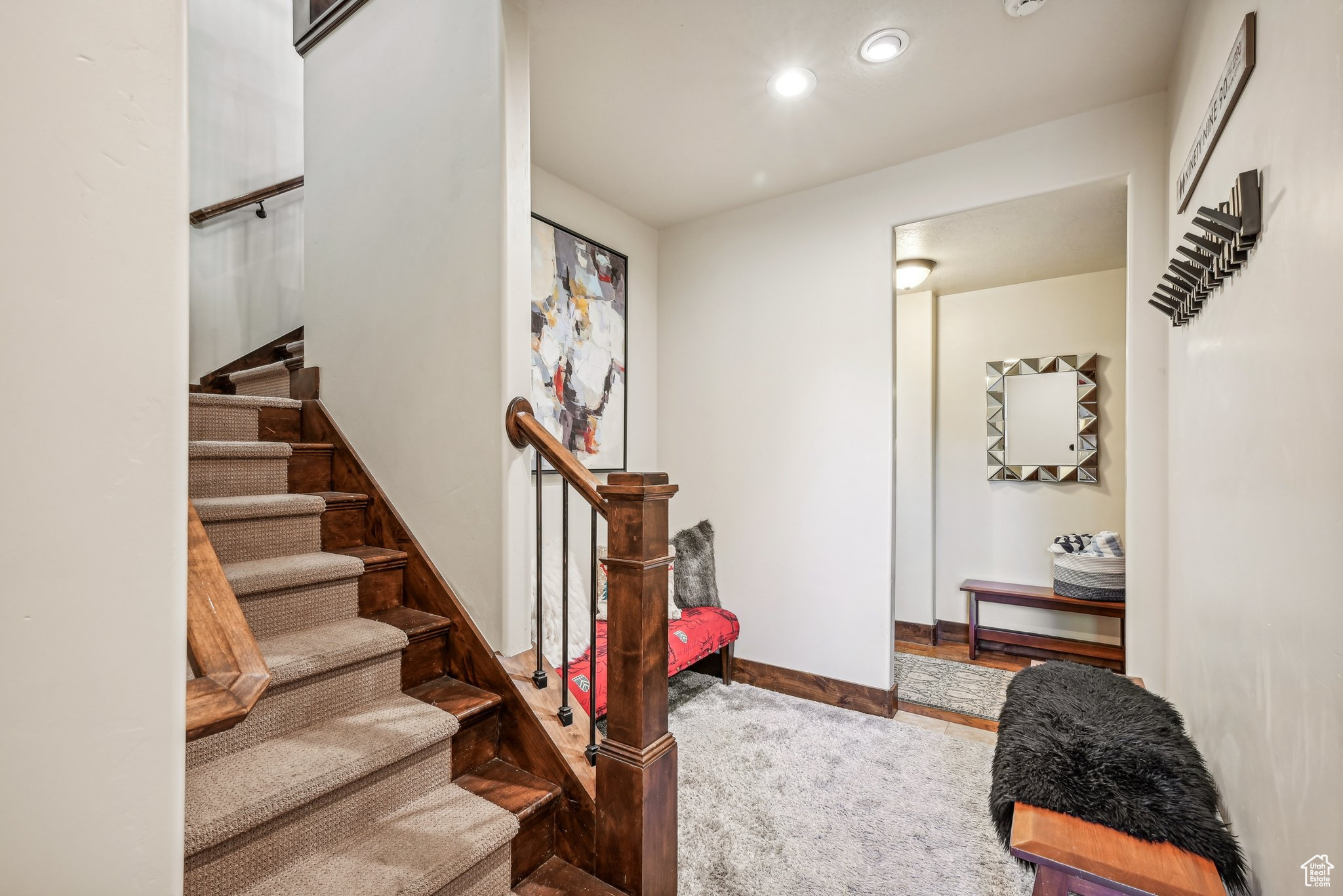 Staircase featuring carpet flooring