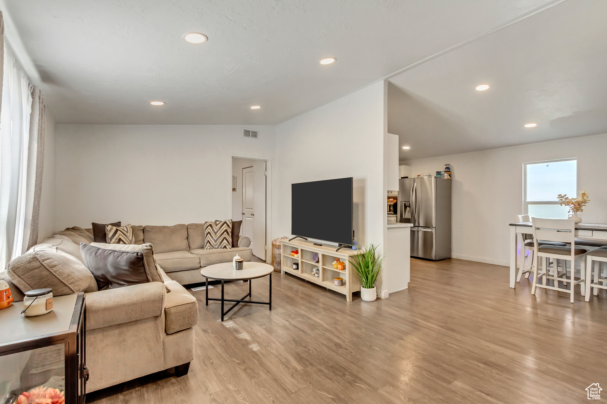 Open Concept Floor-plan with canned lighting and easy access into the large Kitchen.