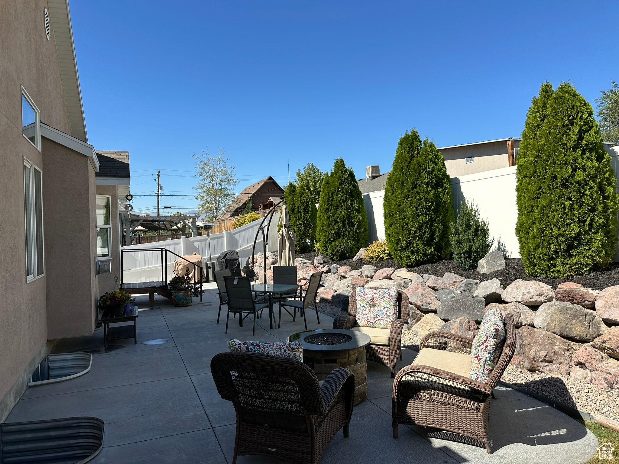 View of patio with a fire pit