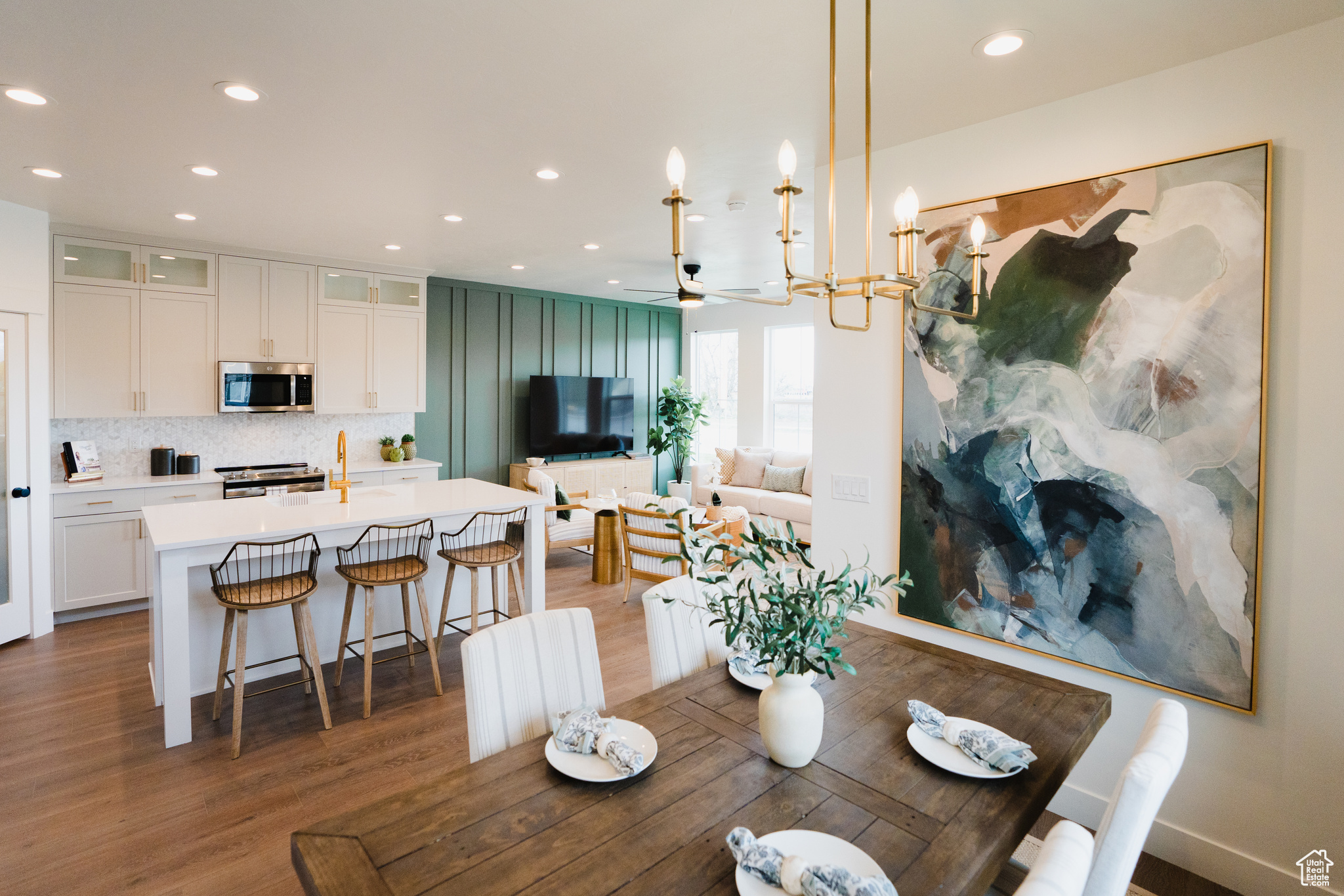 Dining area with ceiling fan and dark wood-type flooring