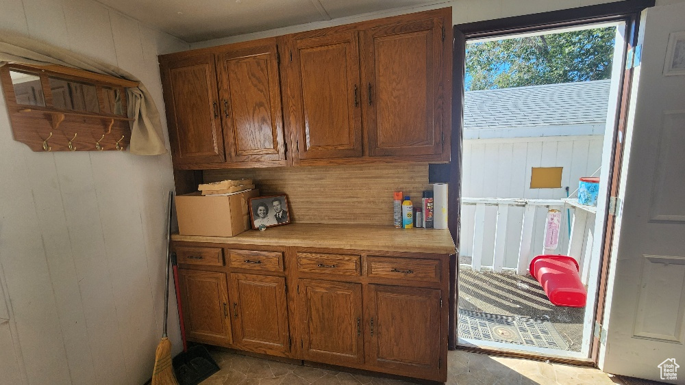 Kitchen featuring wood walls