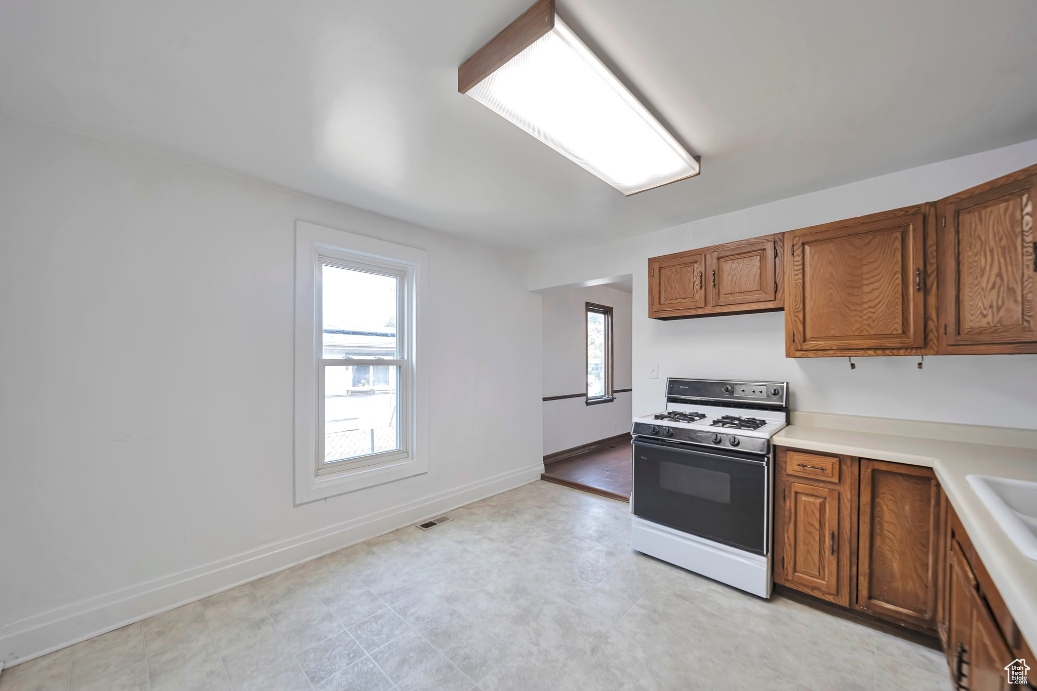 Kitchen looking into formal dining room.