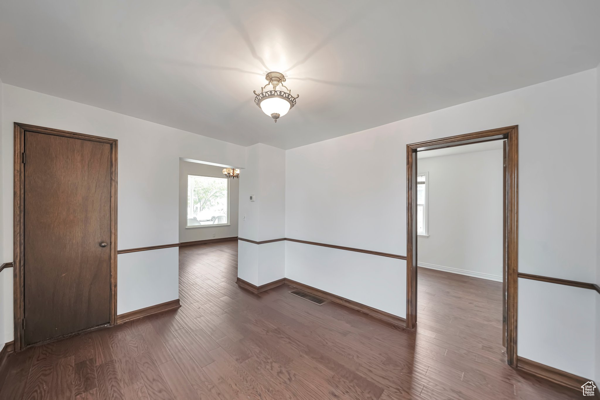 Formal dining room looking into master bedroom and formal living room.