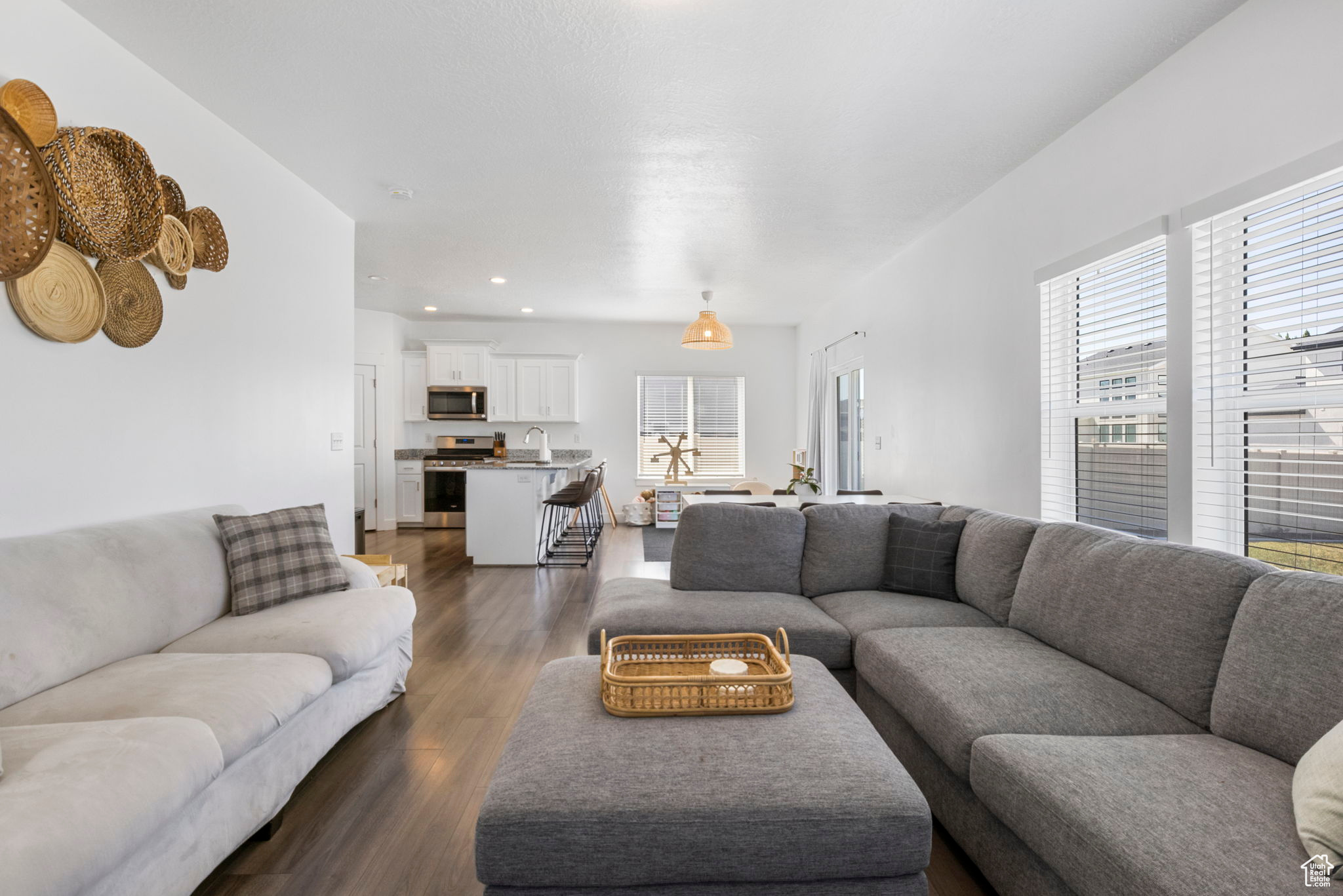 Living room with dark hardwood / wood-style floors and sink