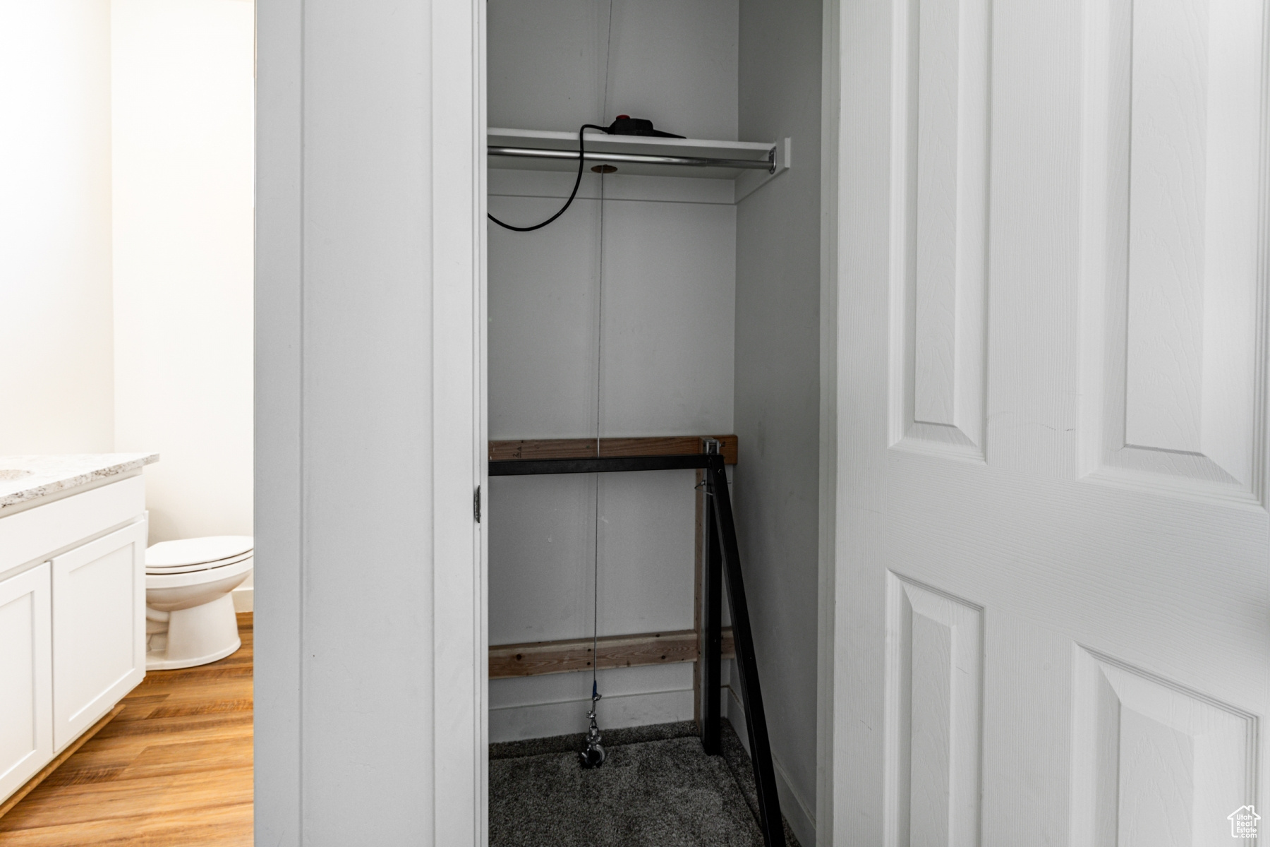 View of closet with elevator to cold storage.