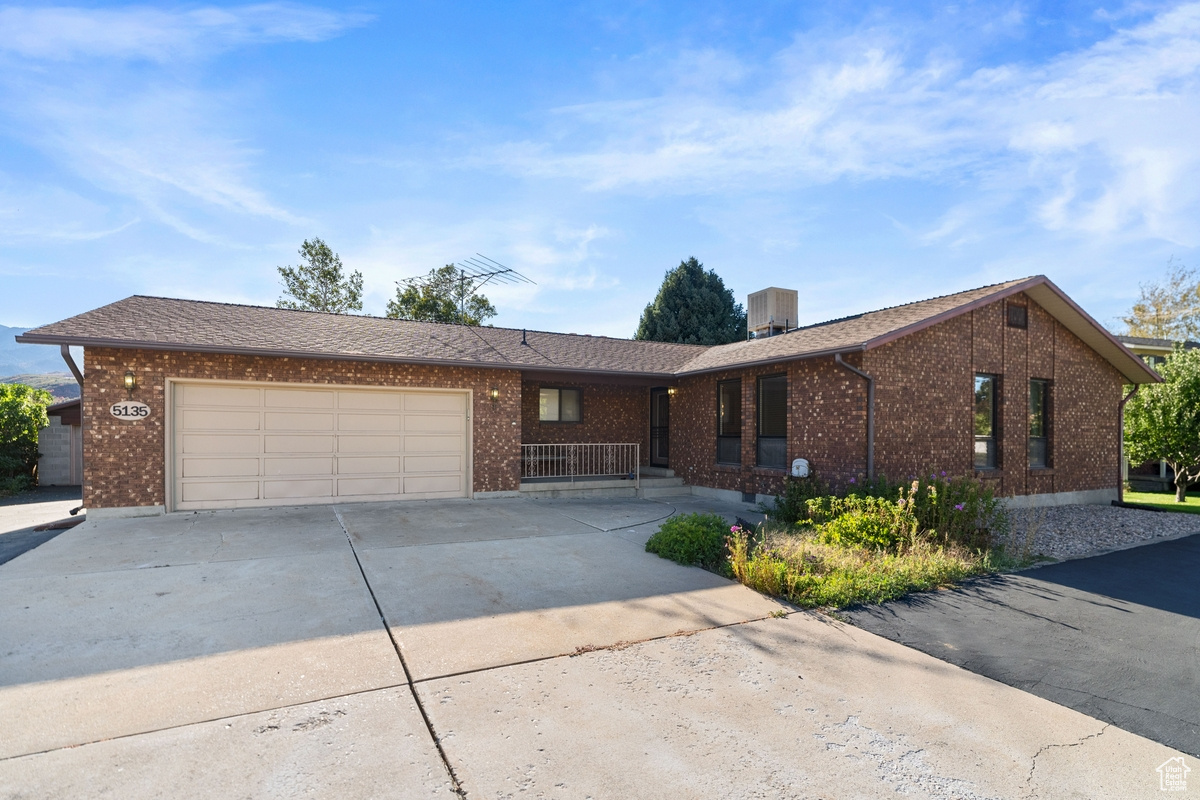 Single story home with a garage