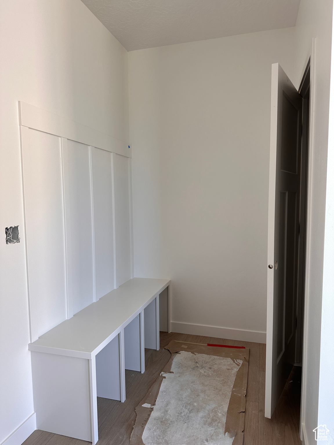 Mudroom featuring wood-type flooring