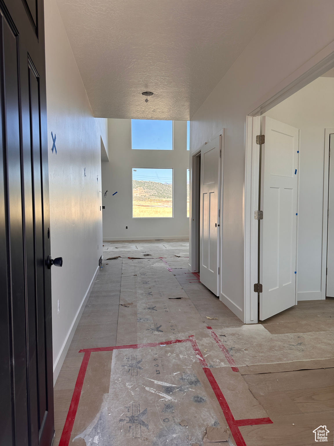 Hallway with a textured ceiling