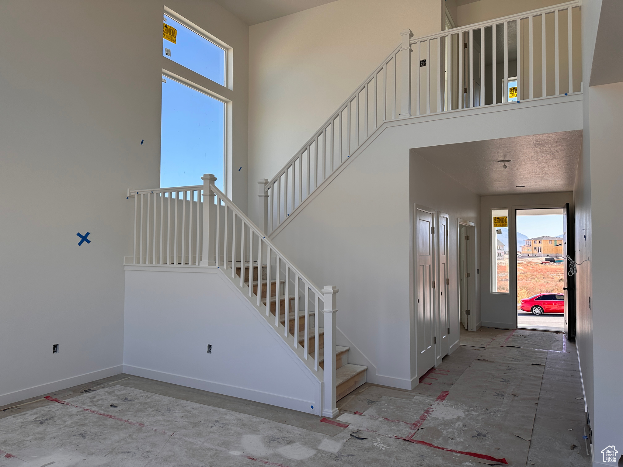 Stairs featuring a towering ceiling