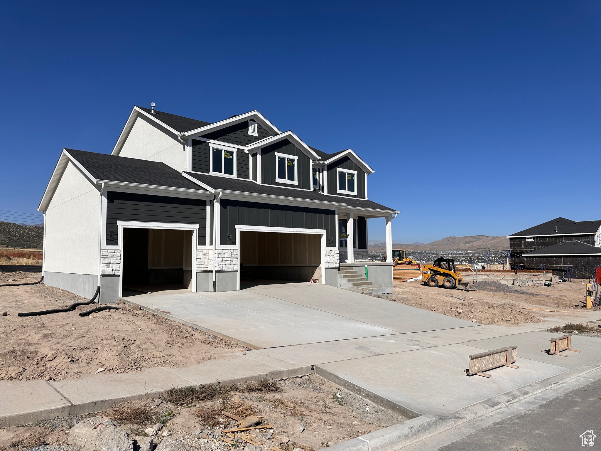 Craftsman-style home featuring a mountain view and a garage