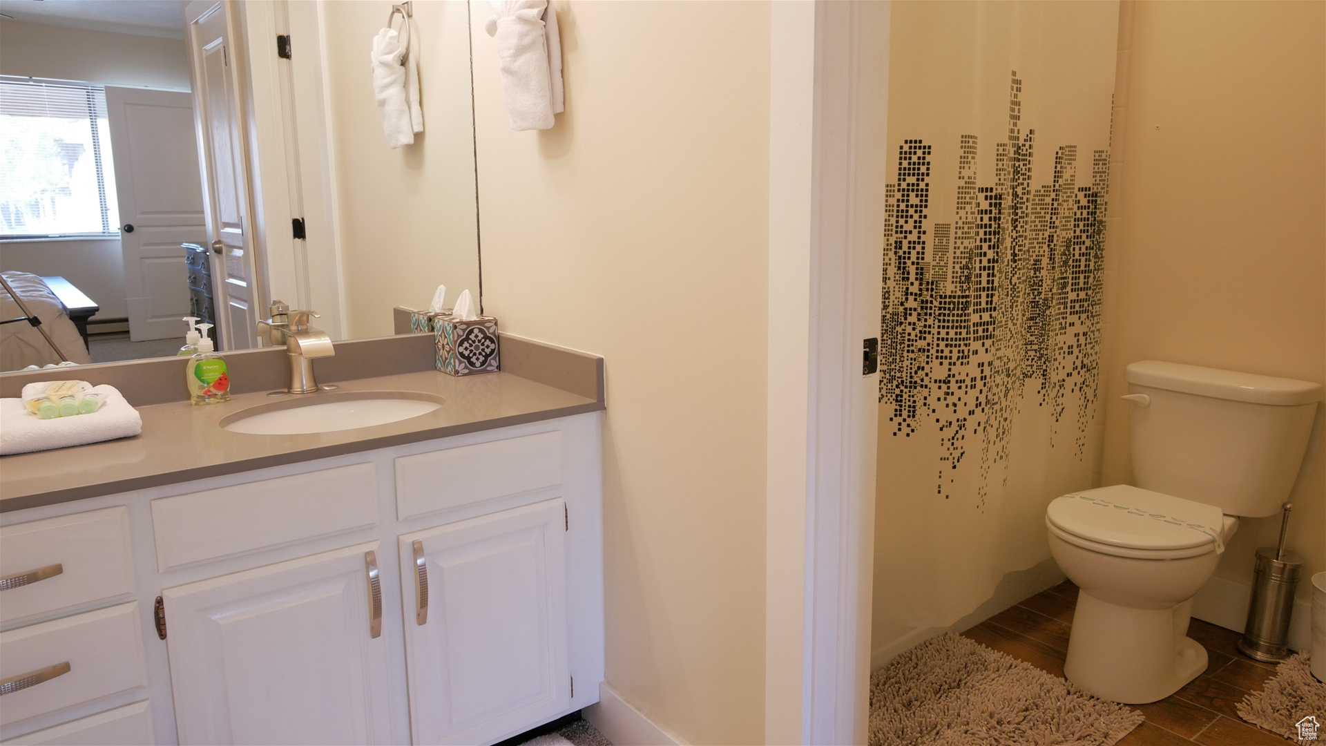 Primary Bathroom featuring vanity and toilet