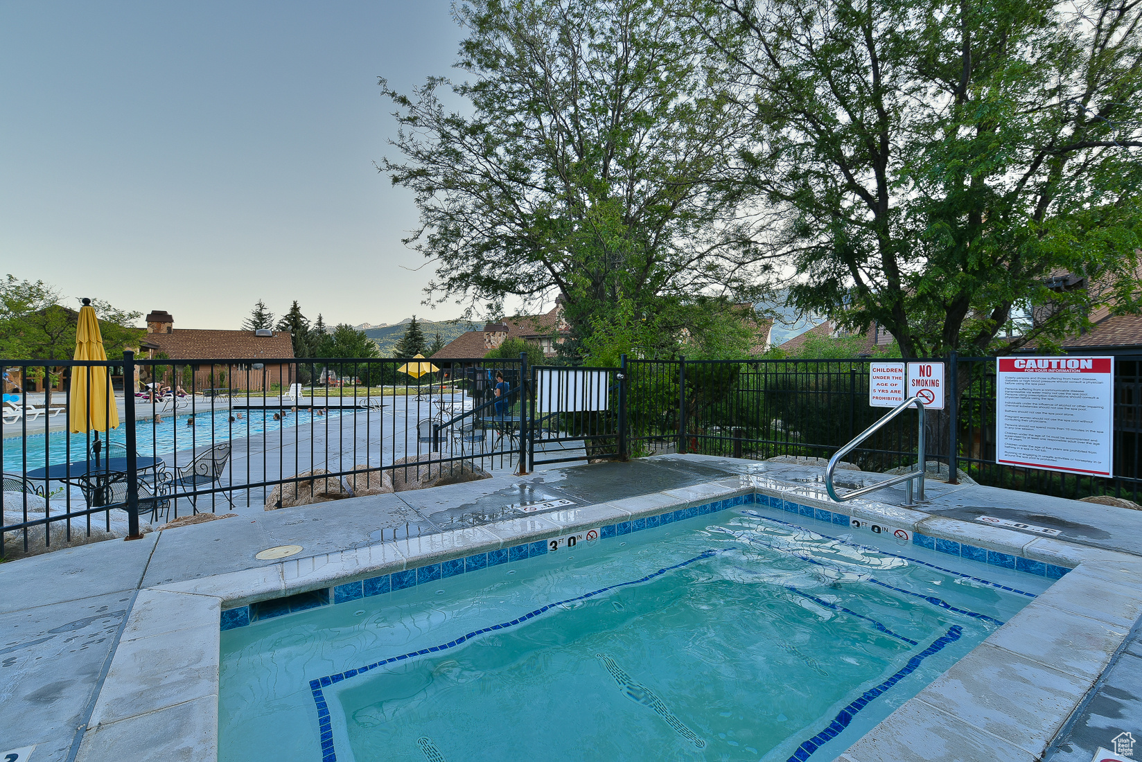 View of pool featuring a community hot tub