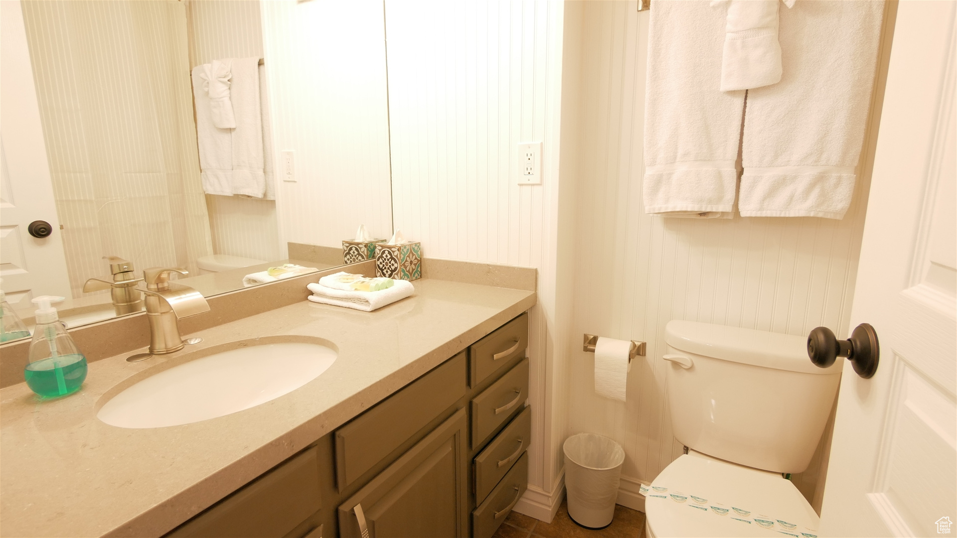 Bathroom featuring vanity and toilet