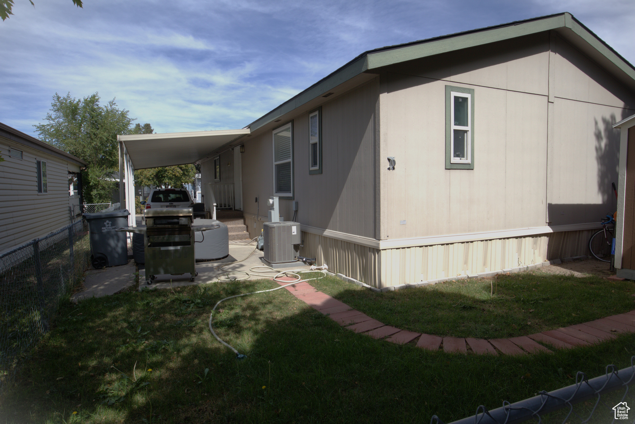 Rear with view to covered parking