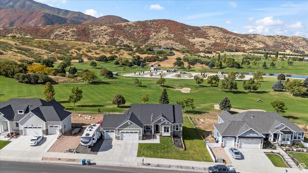 Birds eye view of property with a mountain view