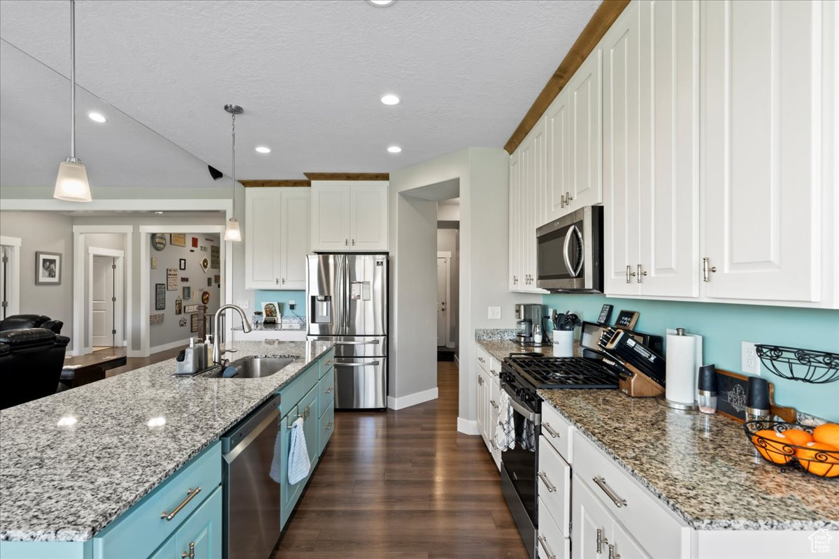 Kitchen with white cabinets and stainless steel appliances