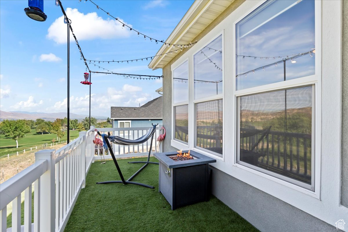 Balcony featuring a fire pit