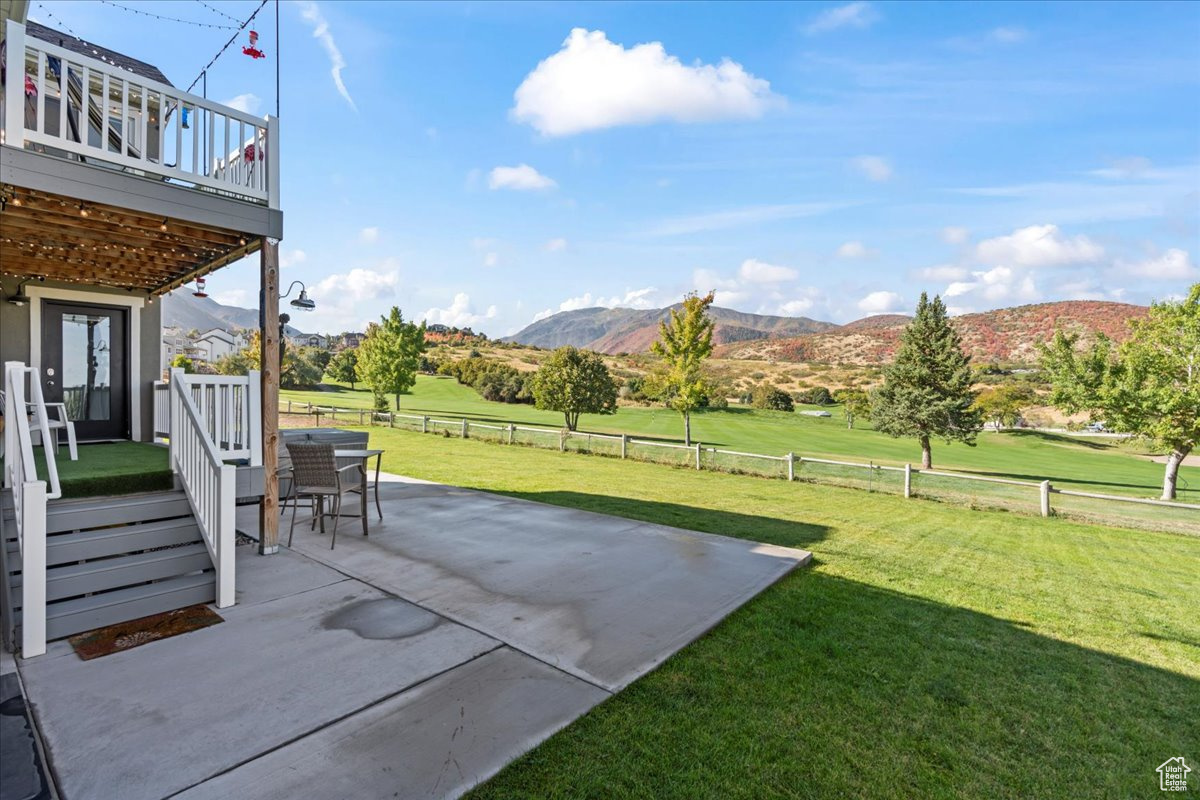 Exterior space featuring a deck with mountain view