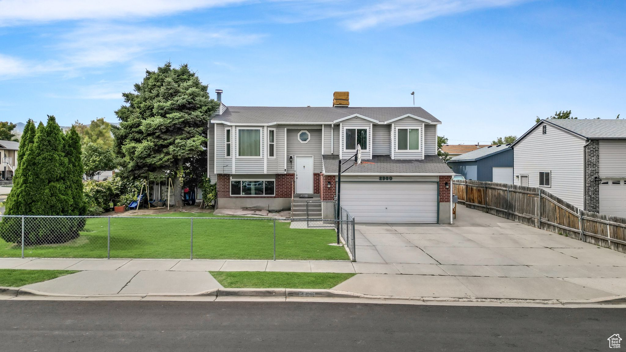 Bi-level home with a front lawn