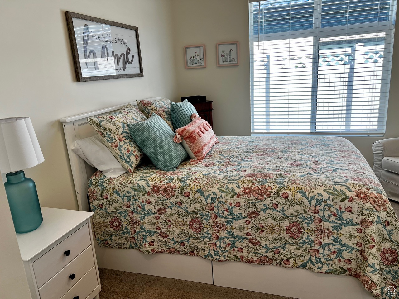 Bedroom featuring dark carpet