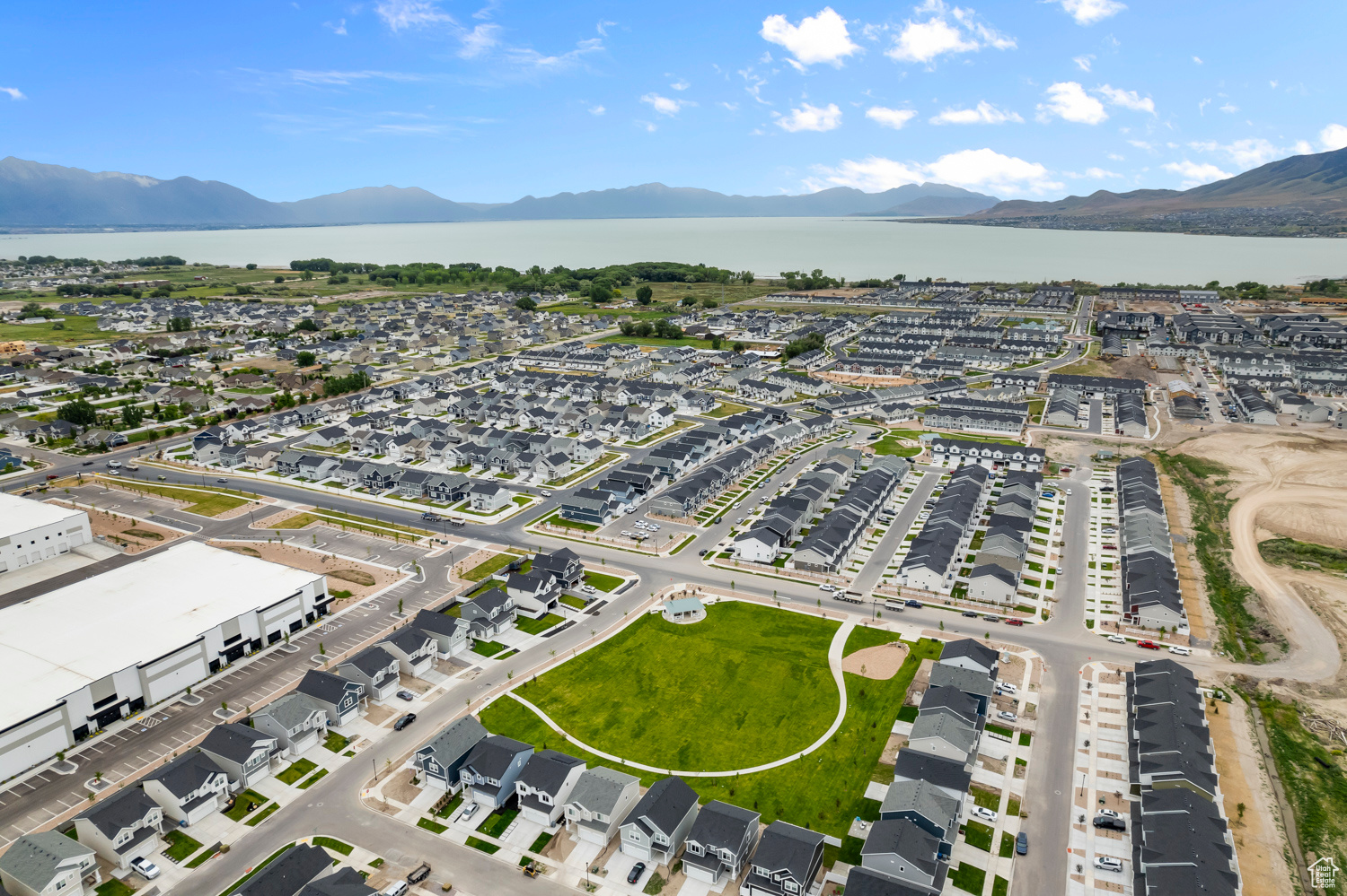 Drone / aerial view with a water and mountain view