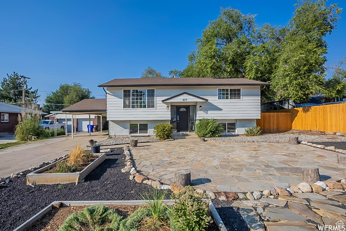 Split foyer home featuring a patio area