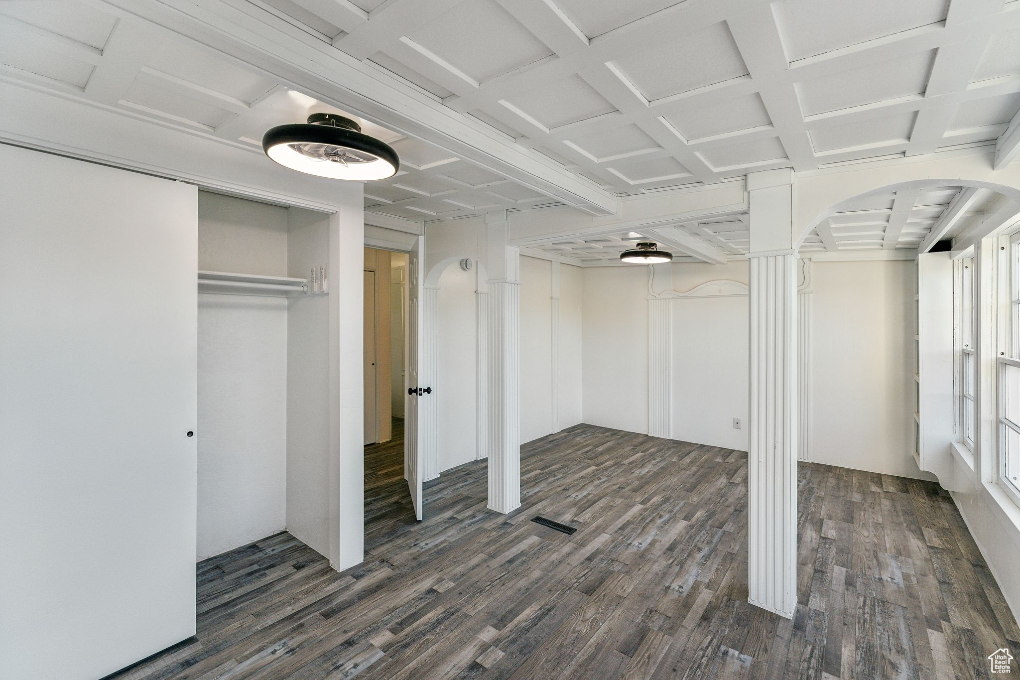 Interior space featuring dark wood-type flooring