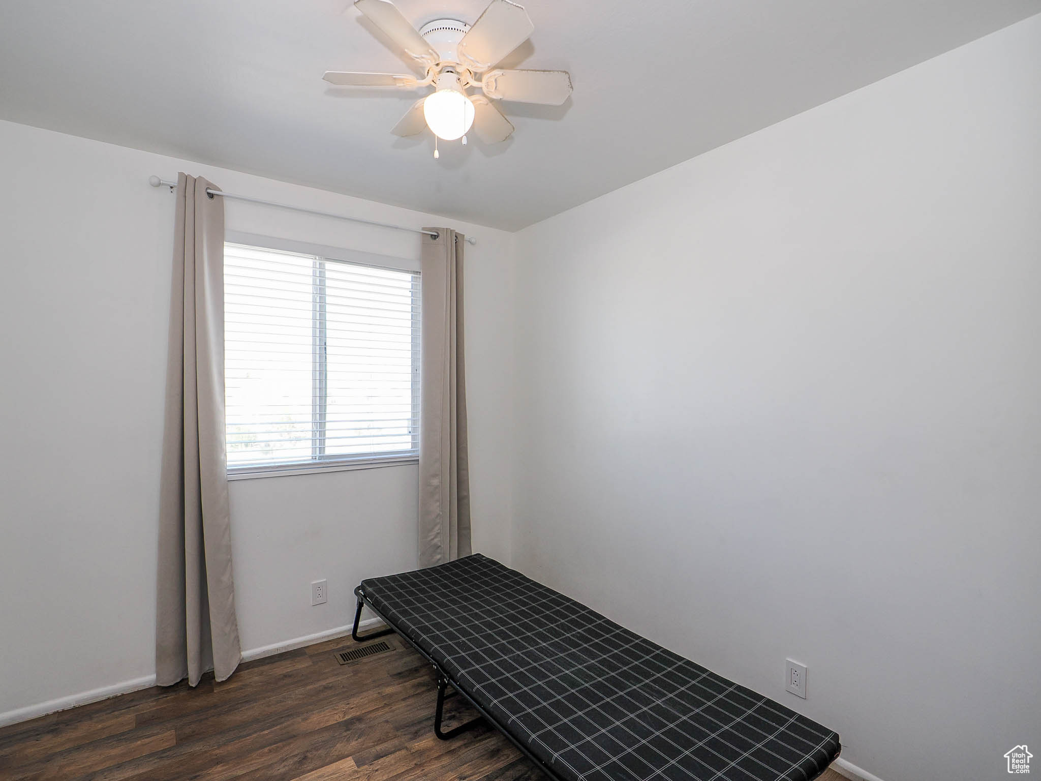 Interior space featuring dark hardwood / wood-style floors and ceiling fan