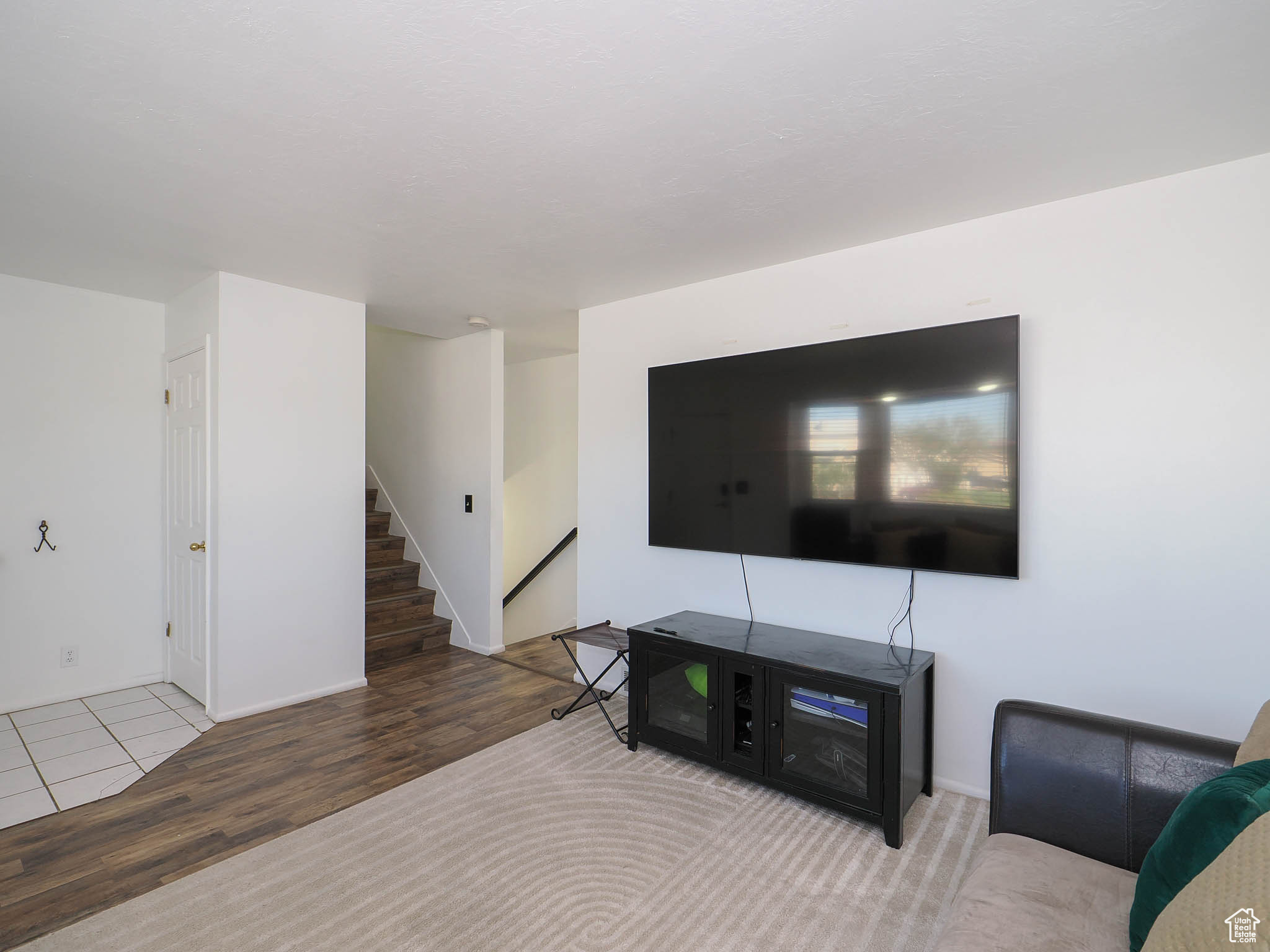 Living room with hardwood / wood-style flooring