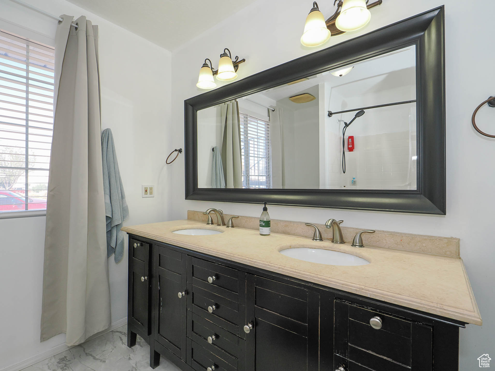 Bathroom featuring walk in shower and vanity