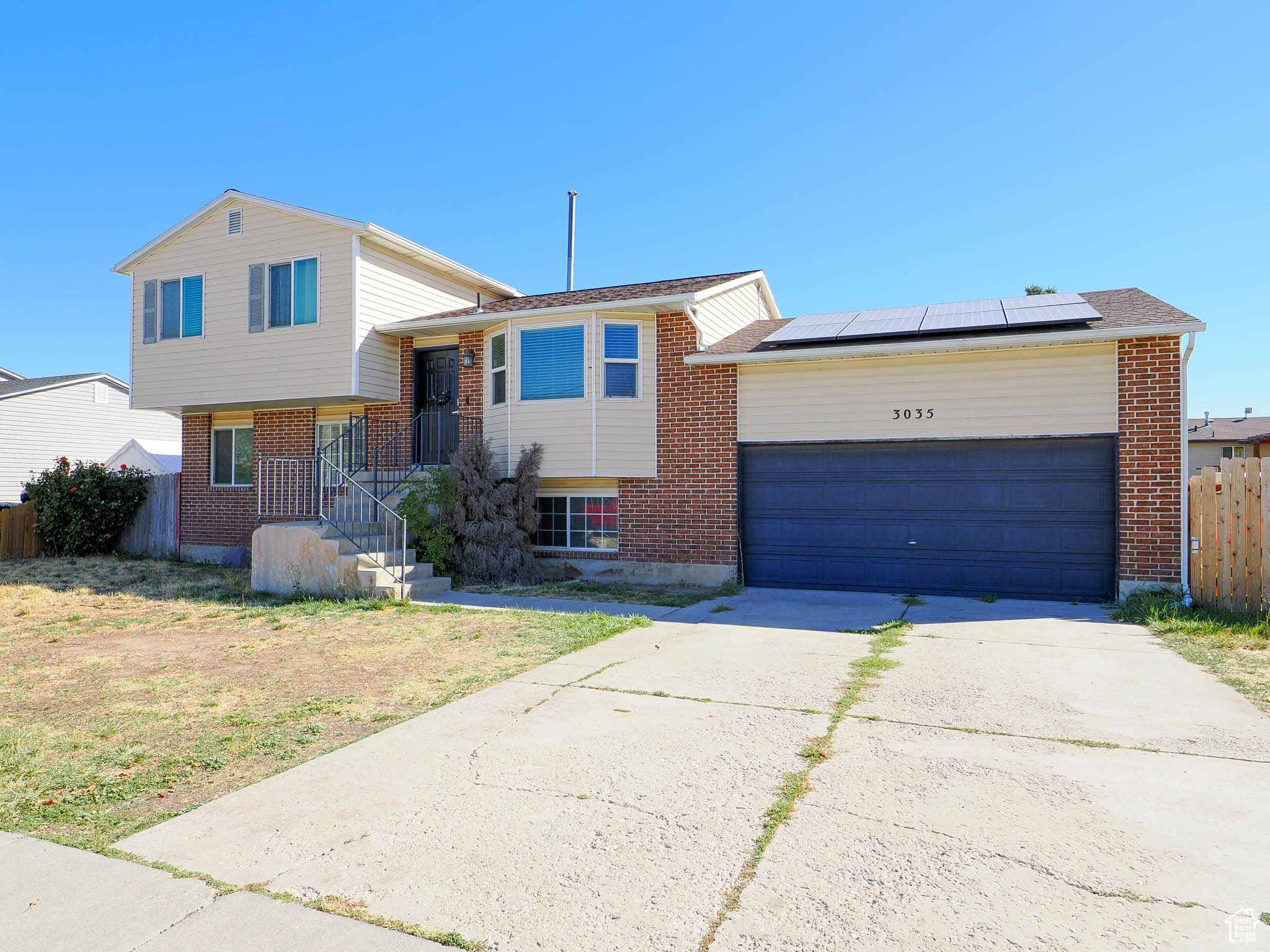 Tri-level home with a garage and solar panels