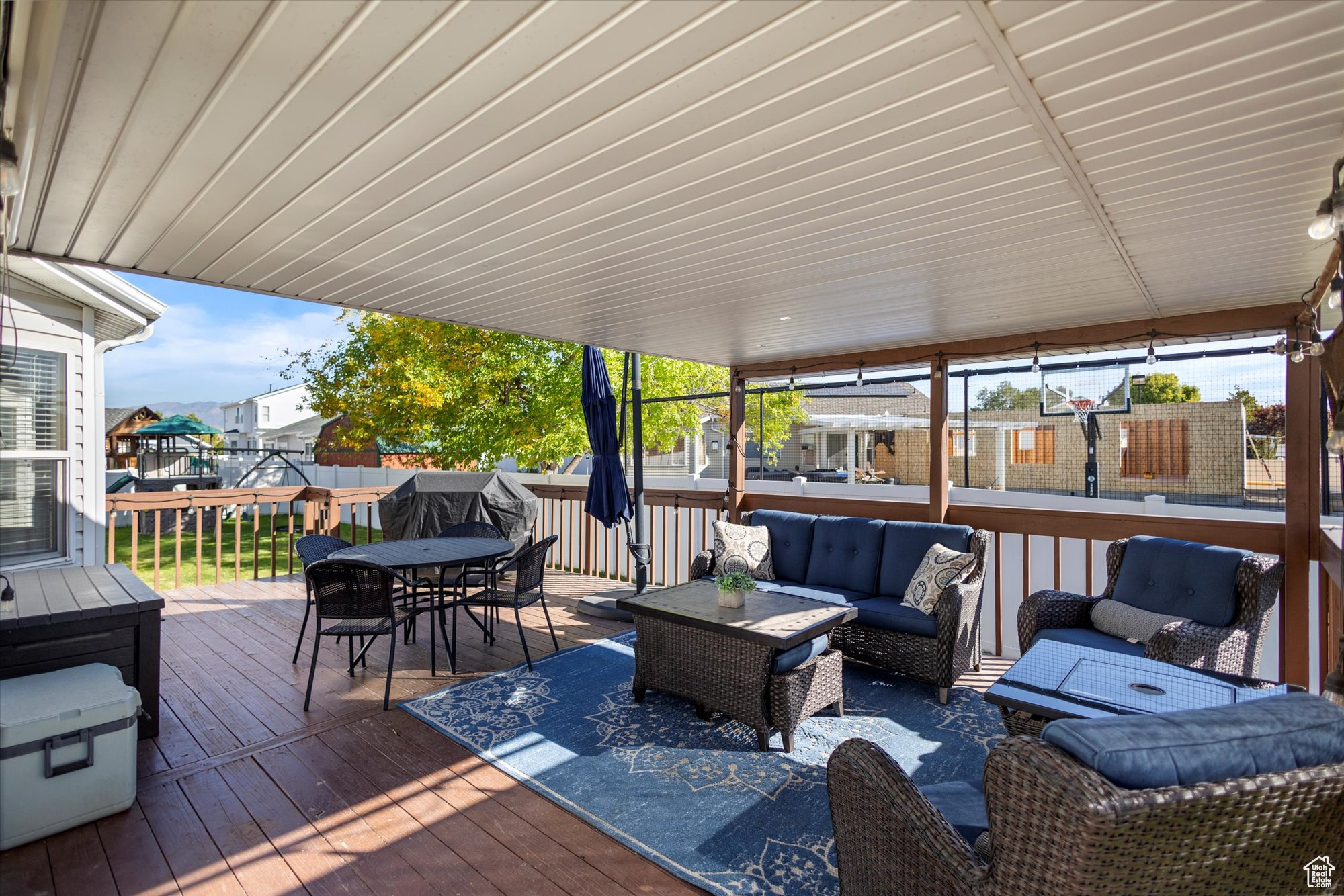 Wooden deck featuring outdoor lounge area