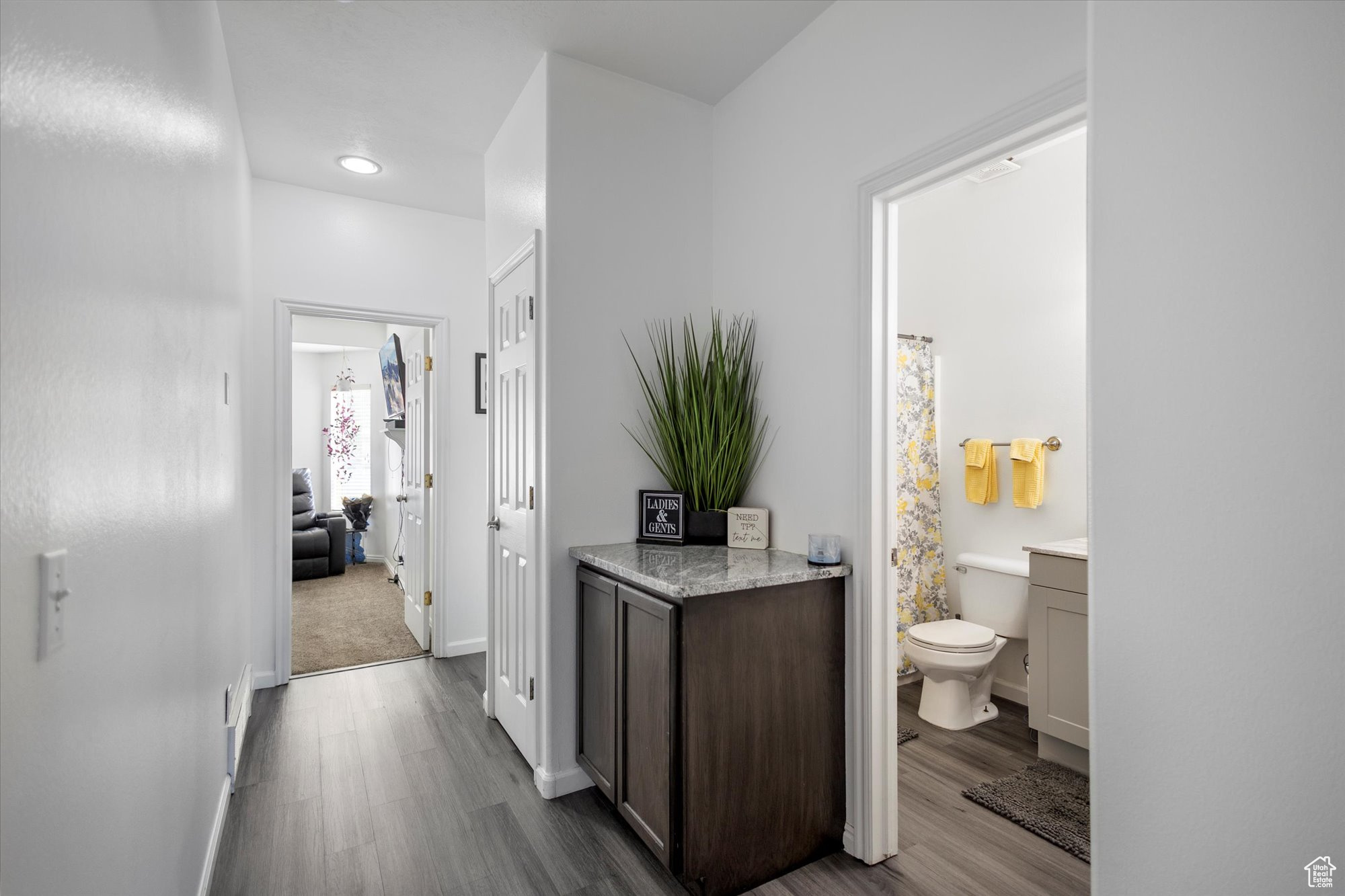 Corridor with light hardwood / wood-style floors