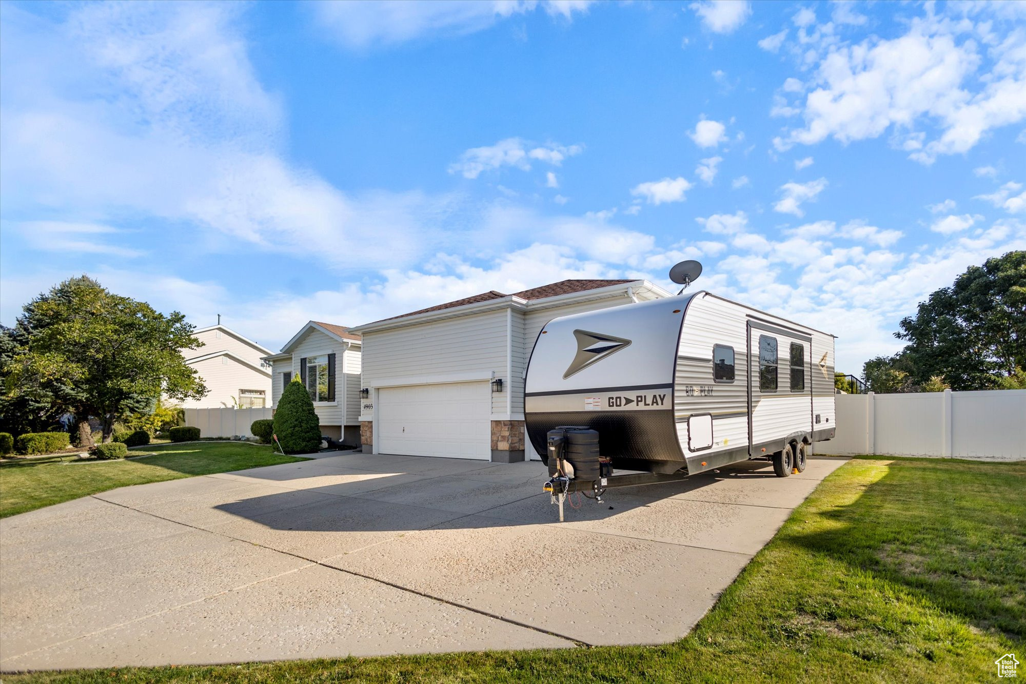 View of home's exterior featuring a yard and a garage