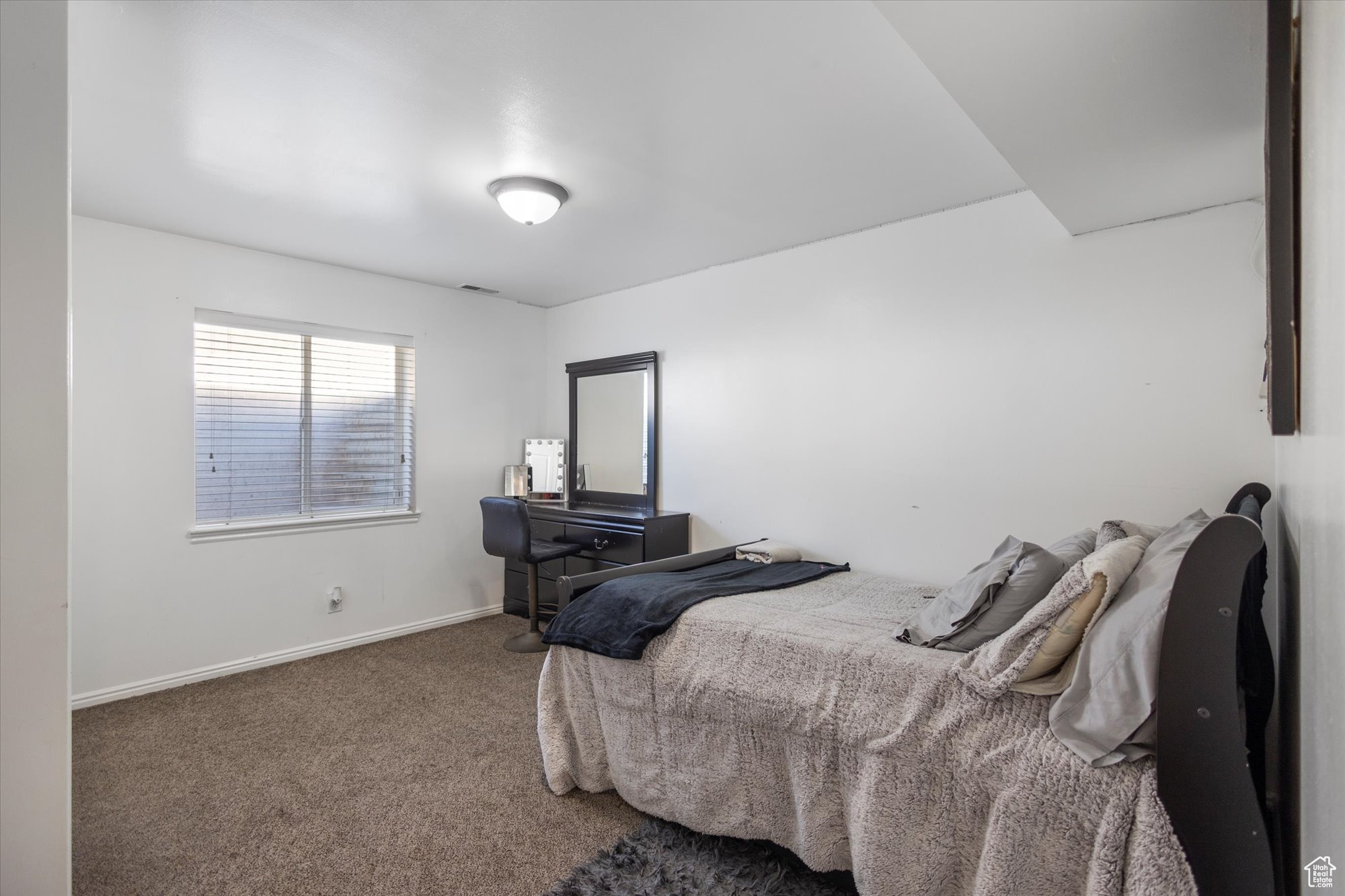 Bedroom featuring carpet flooring