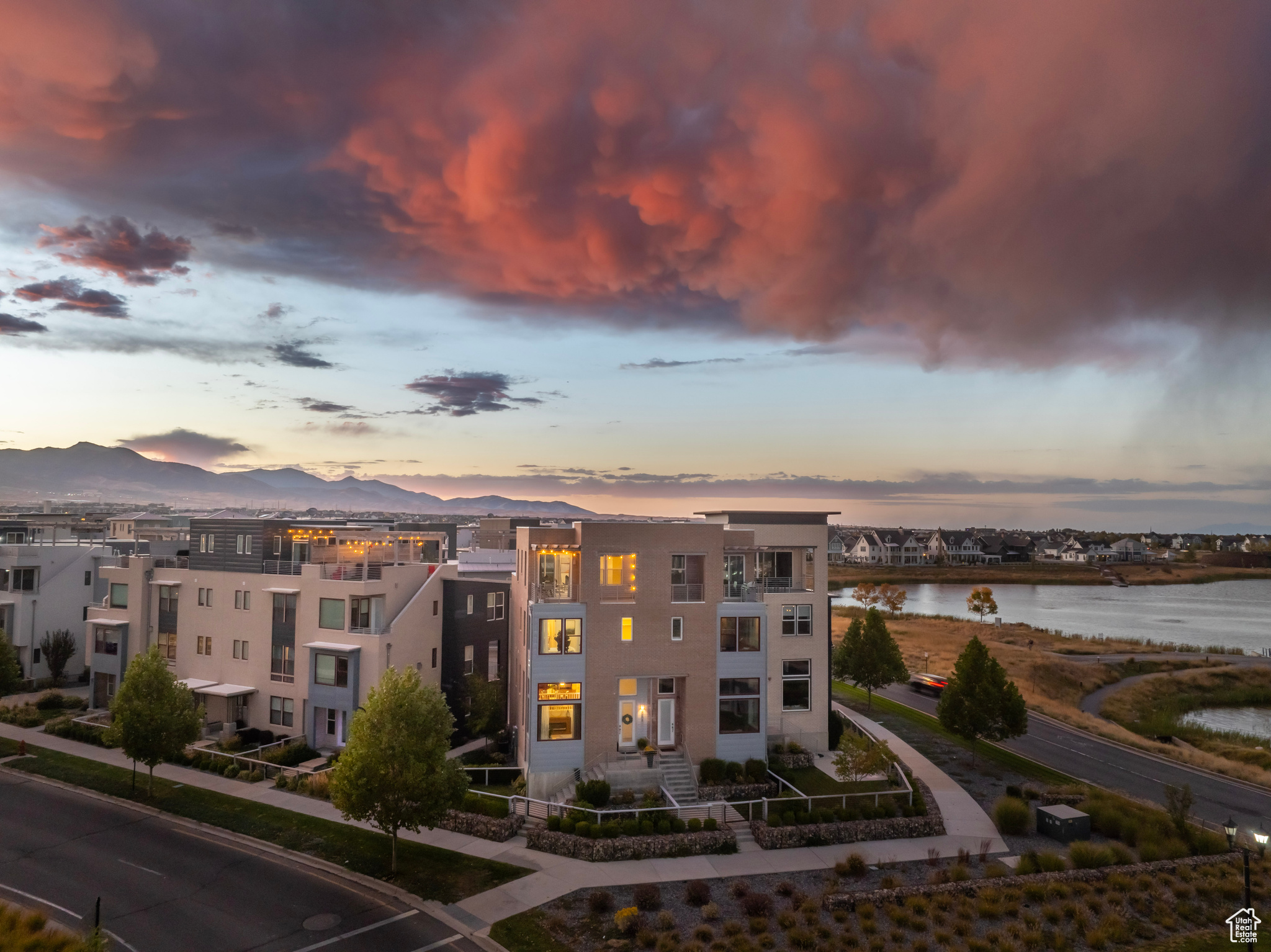 Welcome to this luxury Daybreak townhome just steps from the water, featuring unobstructed mountain views framing the Salt Lake Valley down to Timpanogos and beyond.