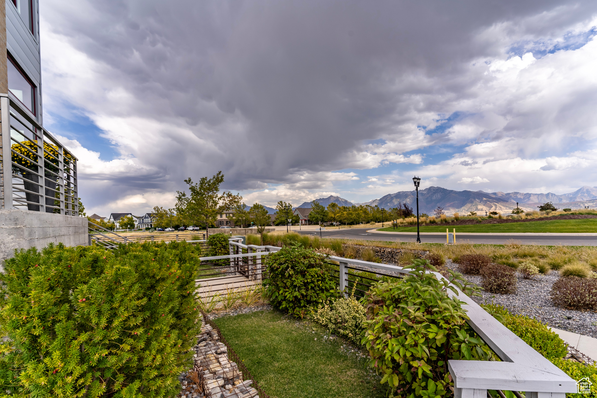 The fully fenced wrap-around front yard offers a quaint ambiance with space on the porch to sit and chat with neighbors.