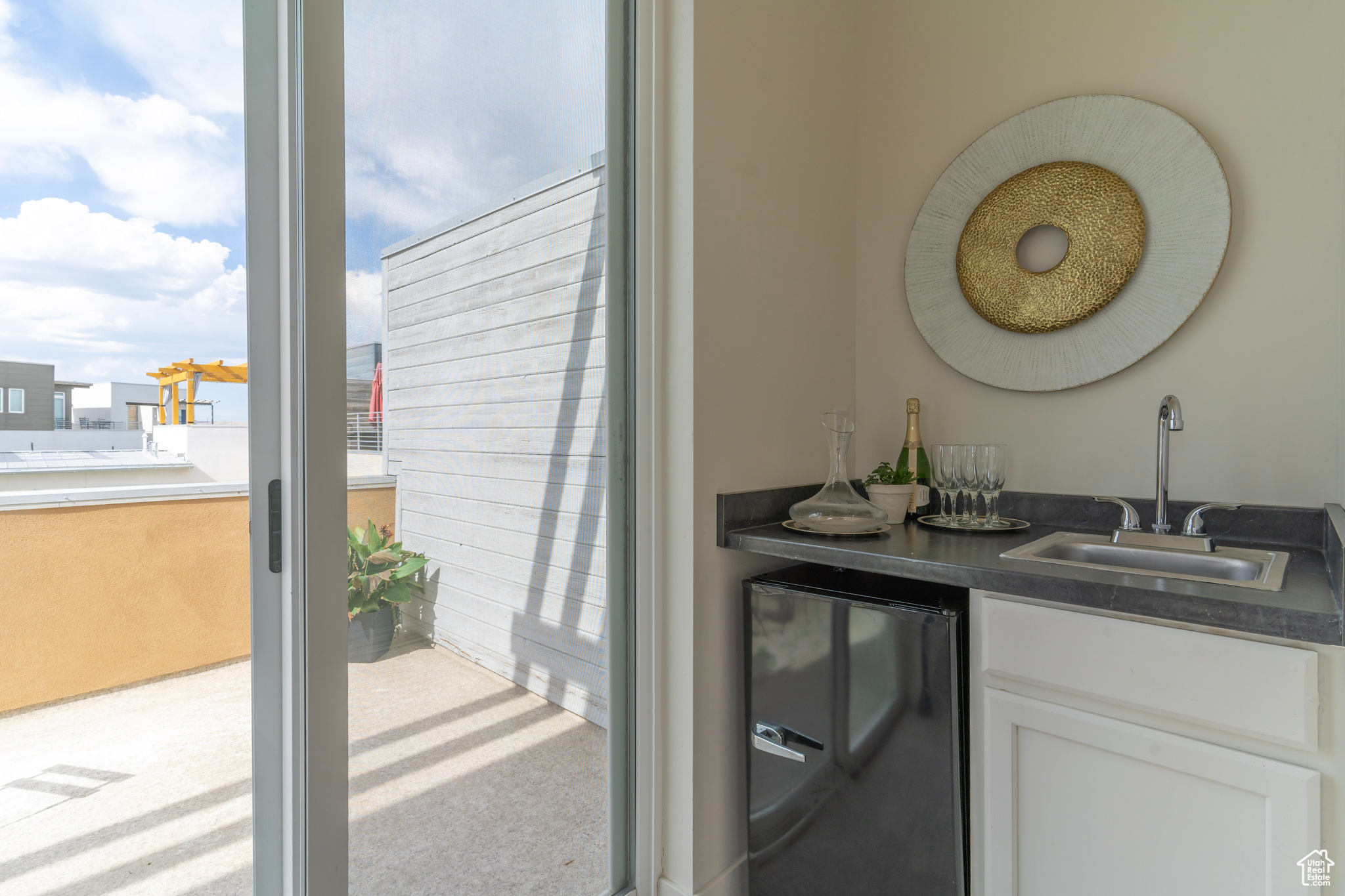 A wet bar with space for mini fridge will keep you and your guests hydrated and entertained as you spend many picturesque moments on the rooftop.