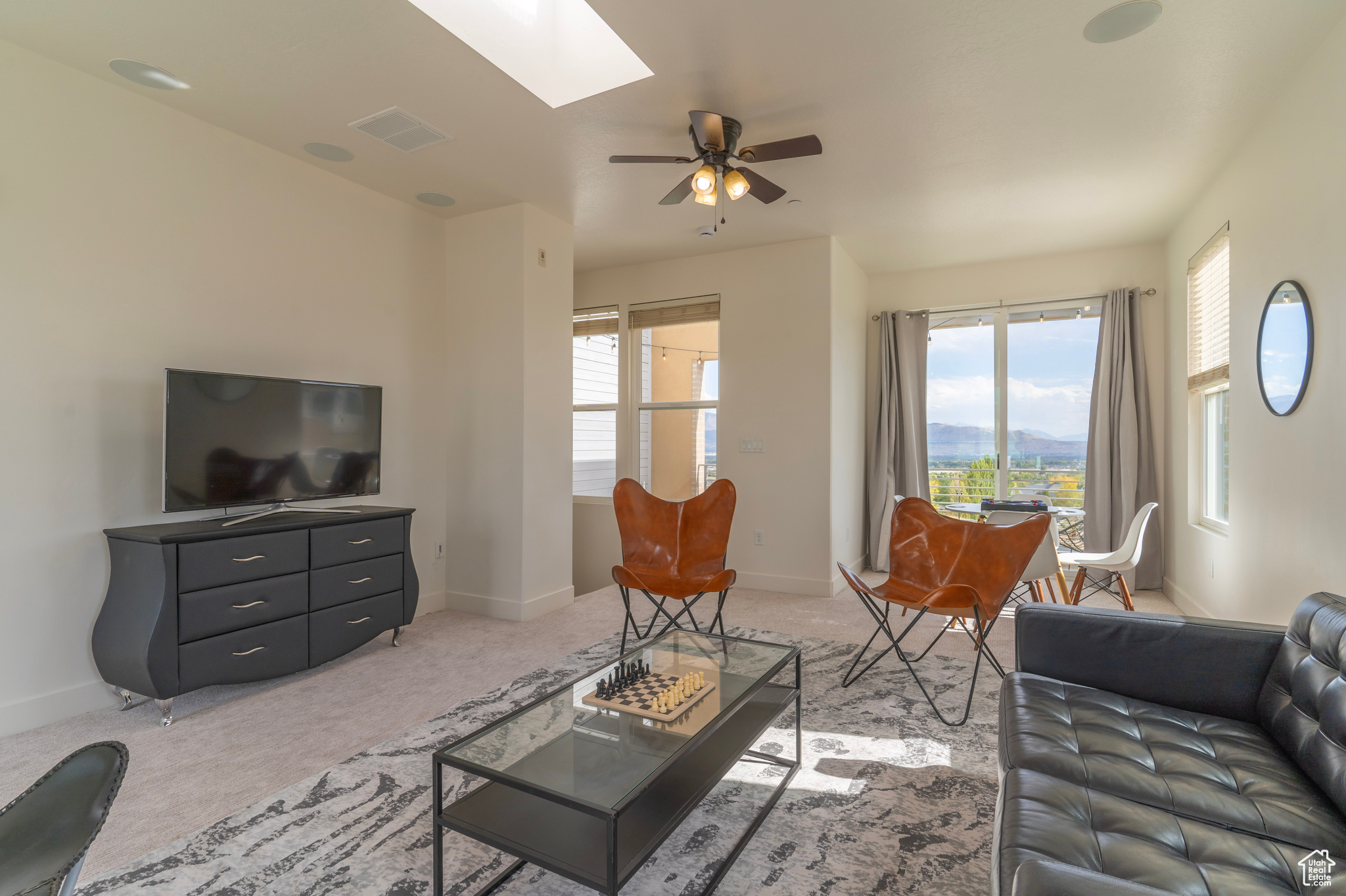 Built-in speakers and a media wall wired for cable and internet make for a perfect entertainment space in this great room in the sky.