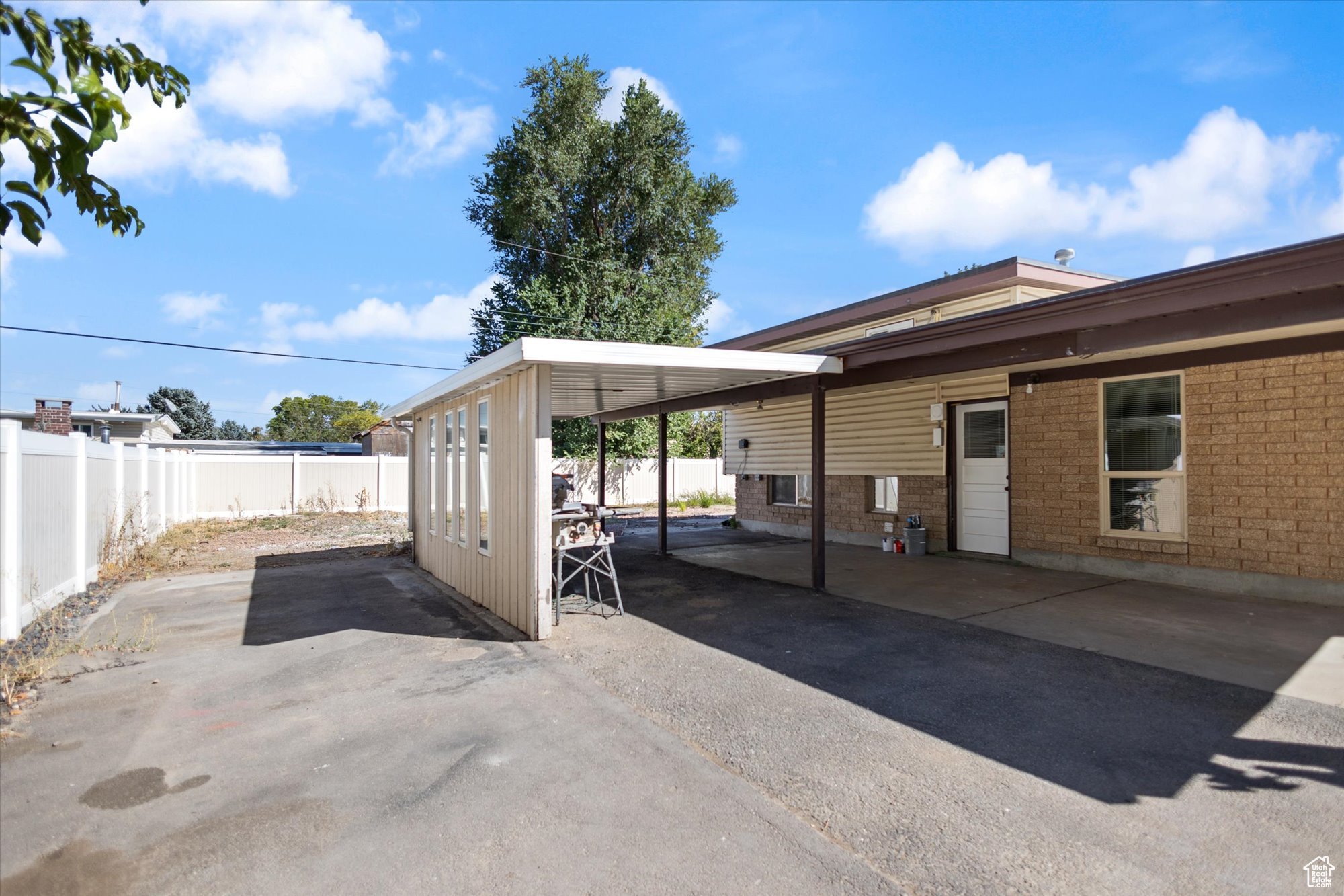 View of patio featuring a carport