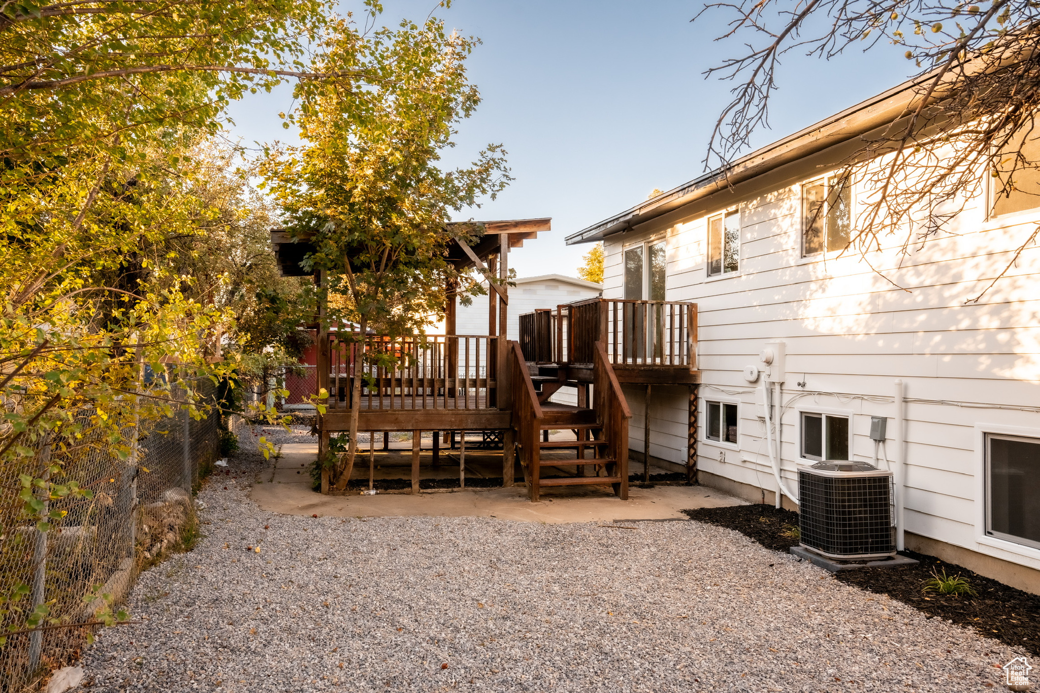 Exterior space featuring a patio, a deck, and central air condition unit