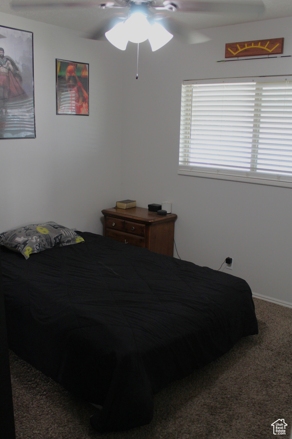 Bedroom with carpet floors and ceiling fan