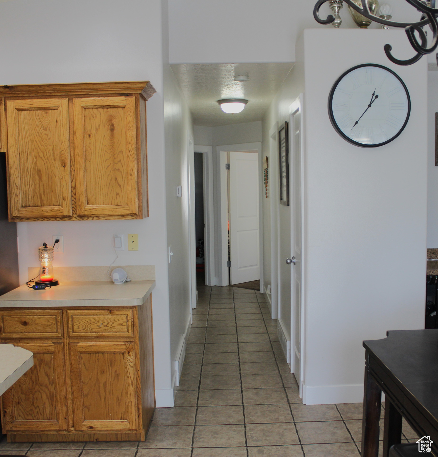 Kitchen featuring a textured ceiling and light tile patterned floors