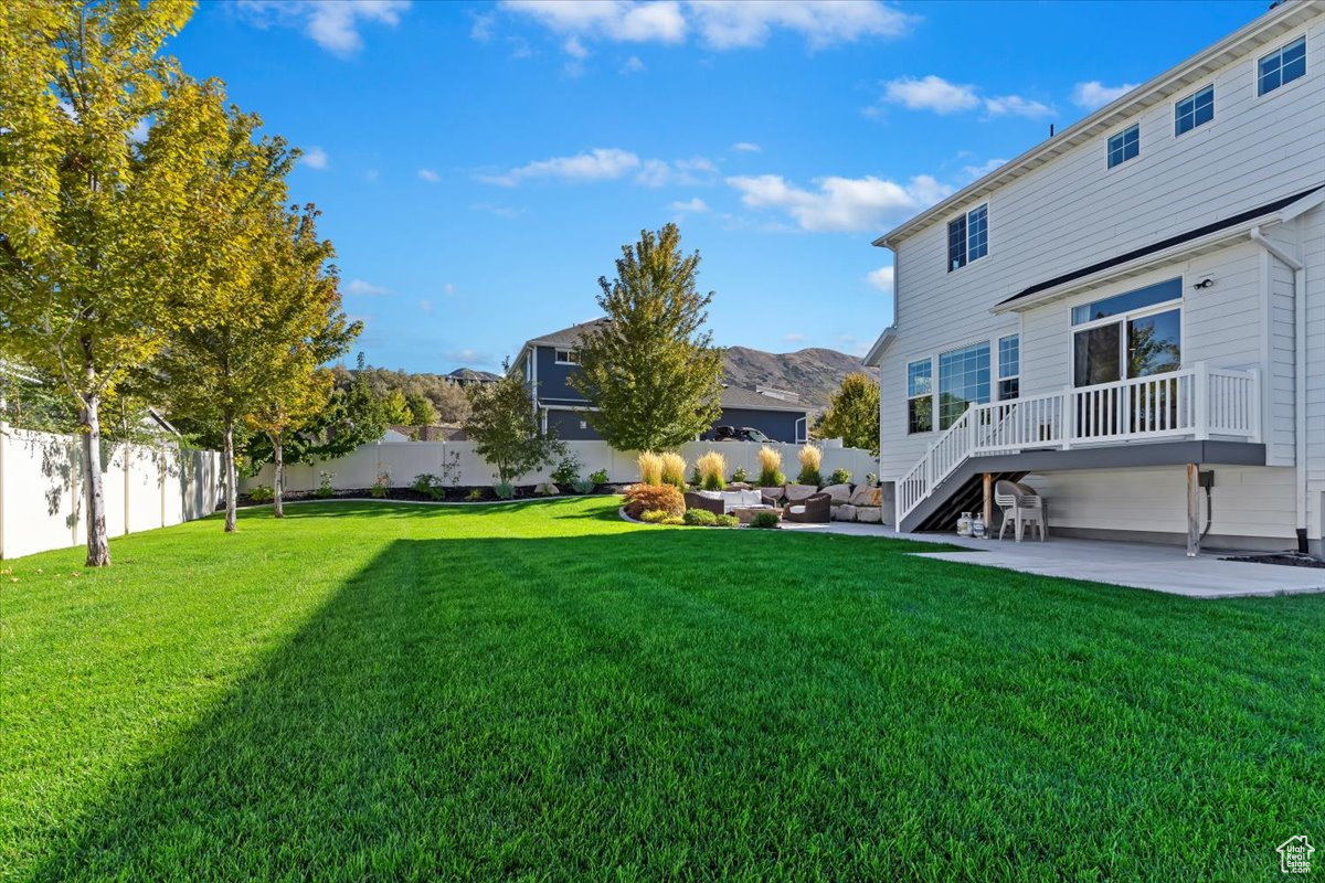 View of yard with a patio