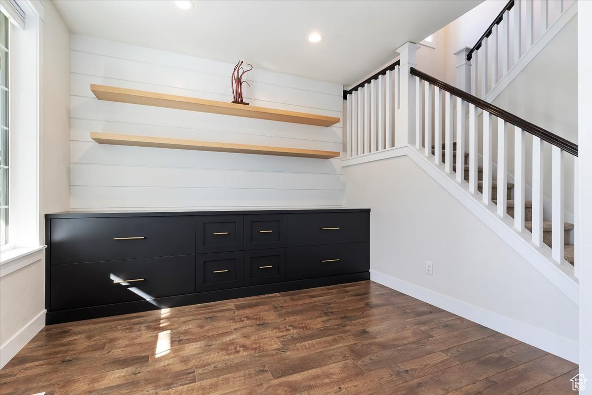 Staircase with hardwood / wood-style flooring