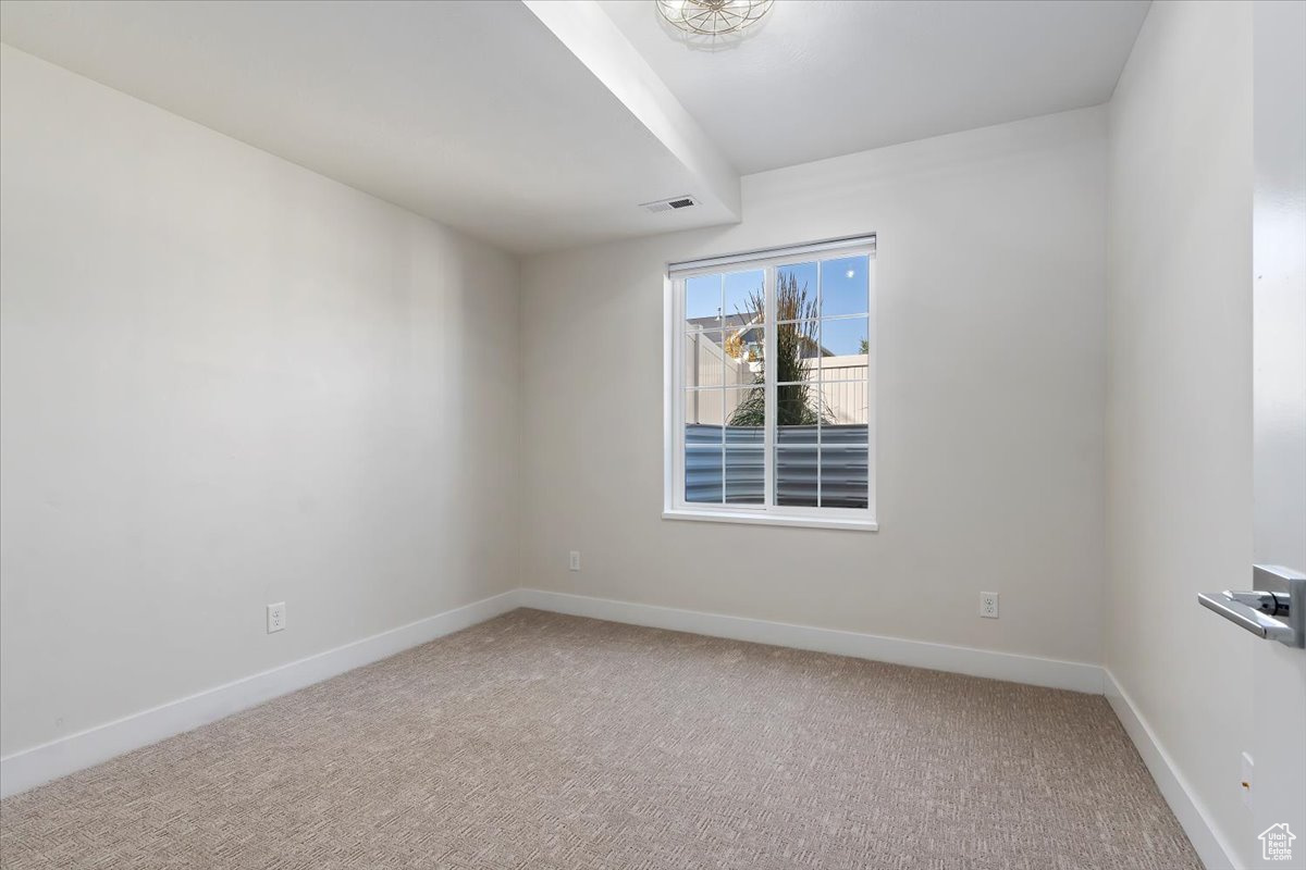 Spare room featuring carpet floors