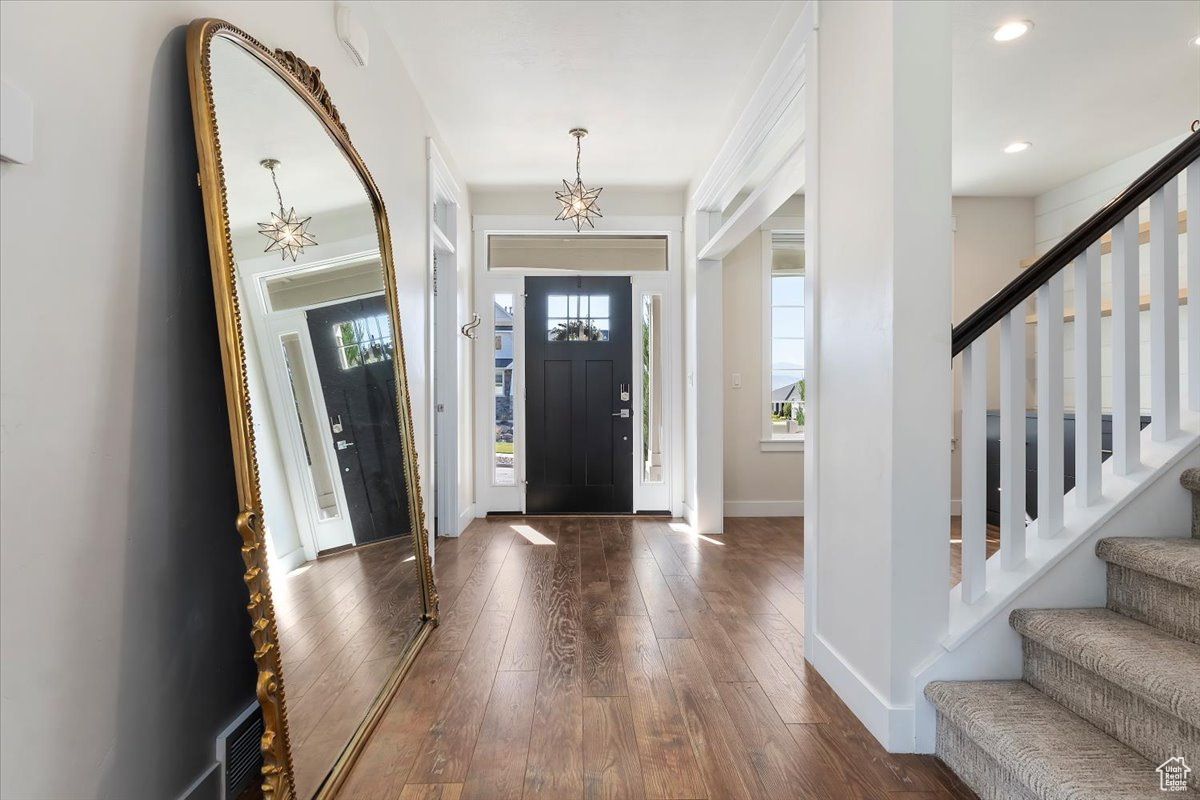 Entryway with dark hardwood / wood-style floors