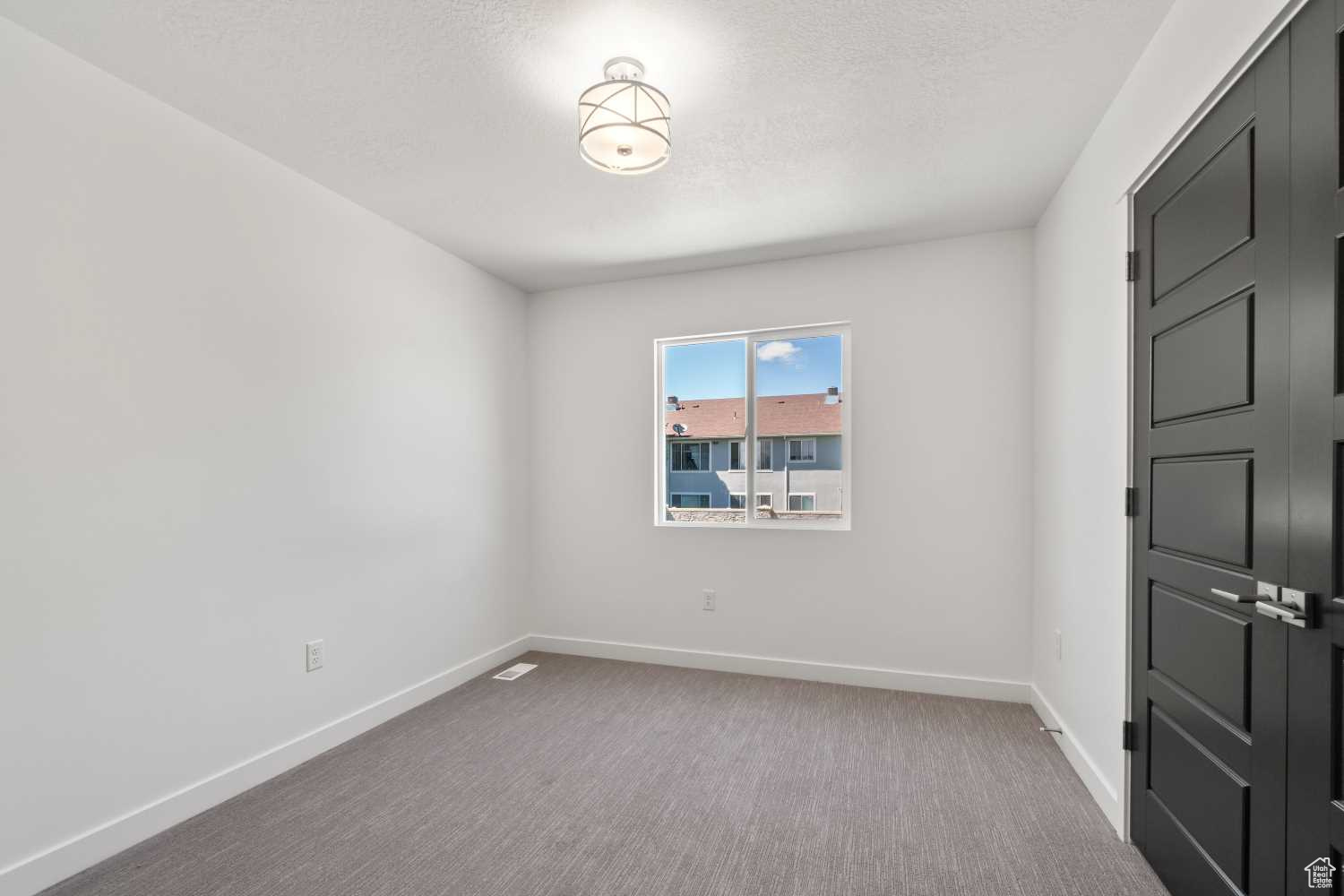 Another bedroom is down the hall featuring a large double-door closet