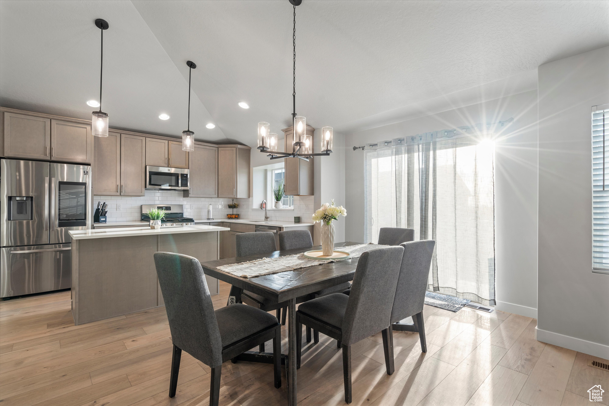 Dining area with a notable chandelie,